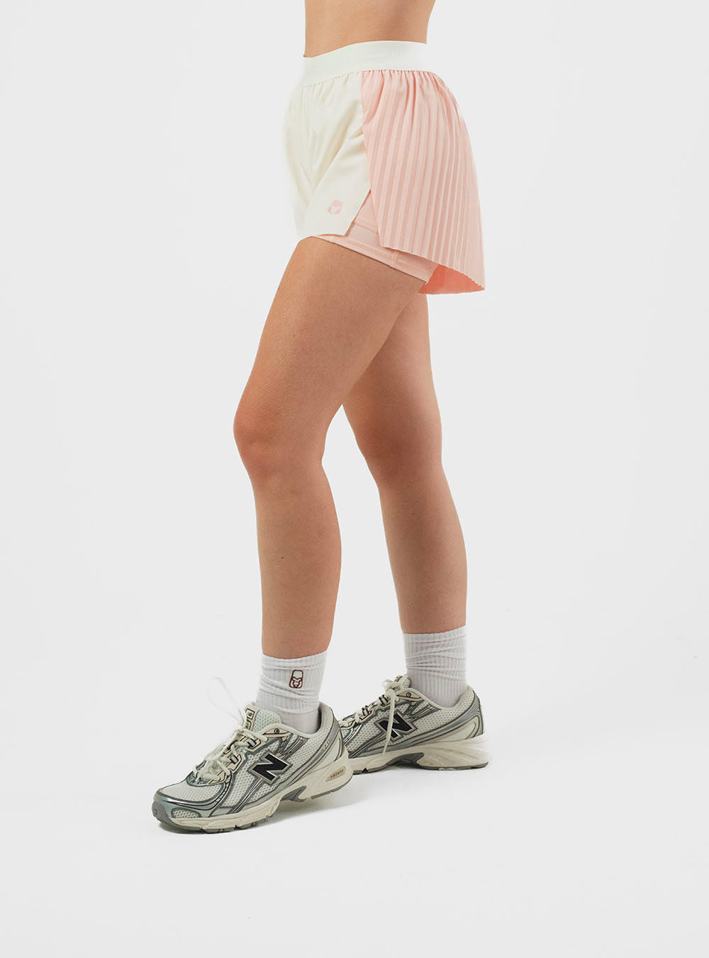PANTALÓN CORTO DE RUNNING CON LYCRA IVORY