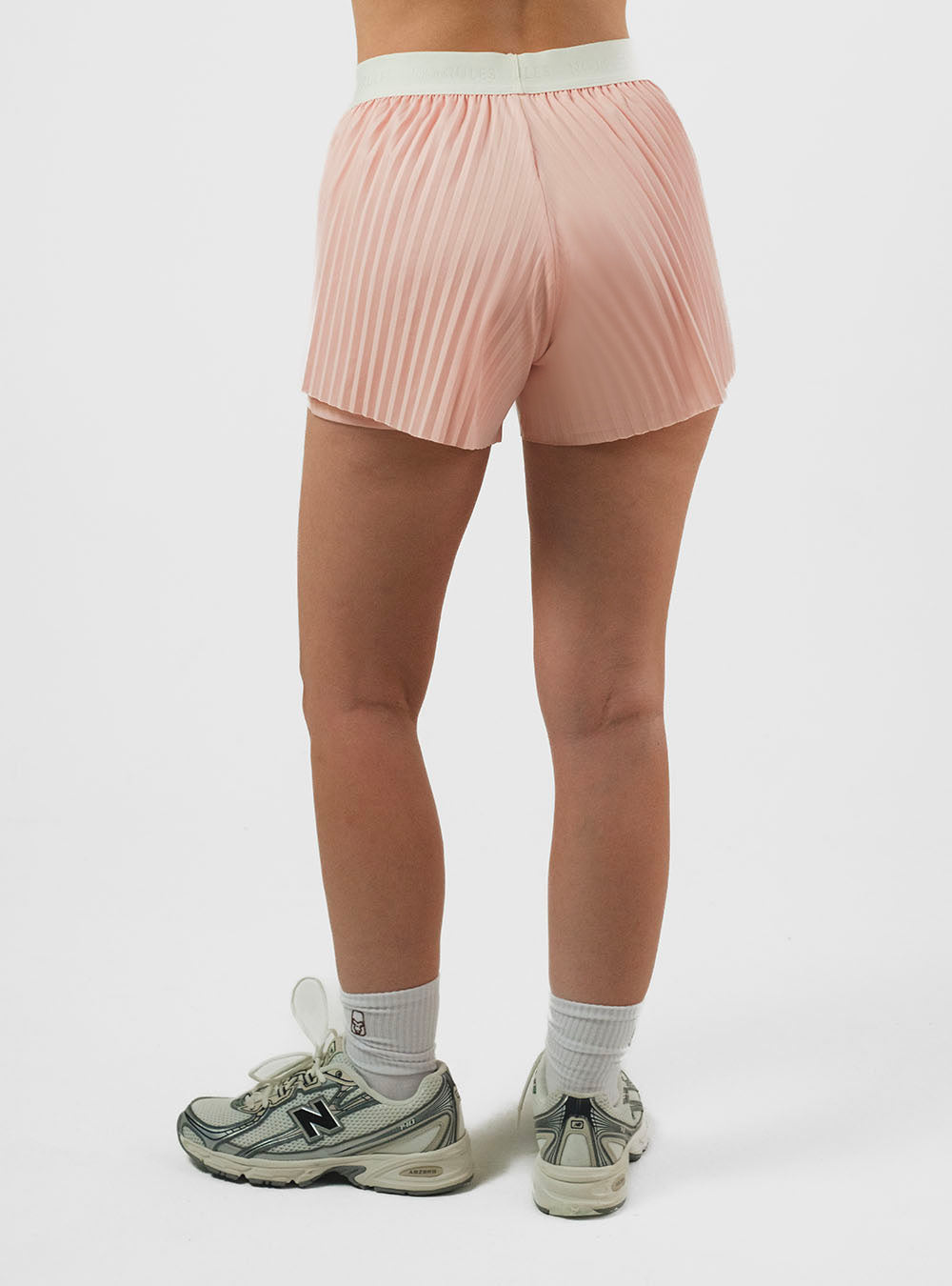 PANTALÓN CORTO DE RUNNING CON LYCRA IVORY